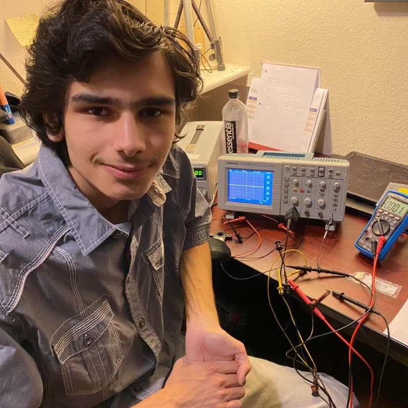 Emilio Martinez III at electronics workbench